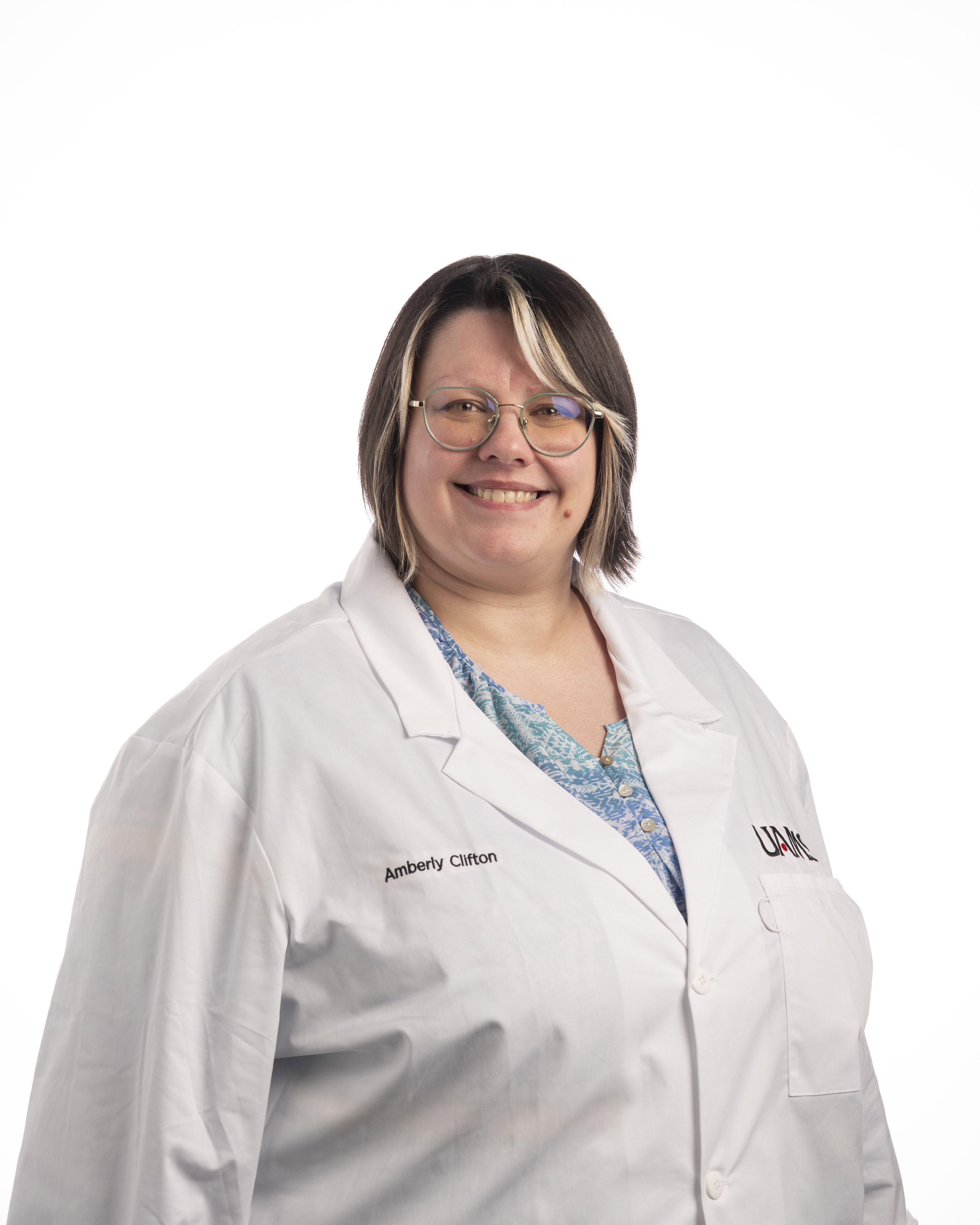Amberly Clifton Professional headshot of Amberly Clifton in a white coat