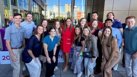 A group of students pose with Governor Sarah Huckabee Sanders
